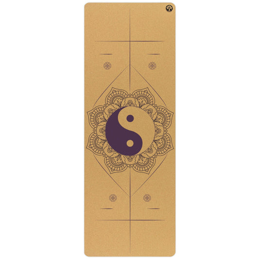 Yoga mat with yin yang symbol and mandala design on a white background