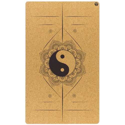 Yoga mat with yin yang symbol and mandala design on a white background