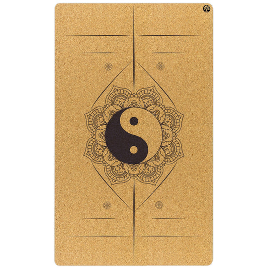 Yoga mat with yin yang symbol and mandala design on a white background